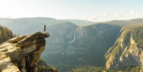Hiker,At,The,Glacier,Point,With,View,To,Yosemite,Falls